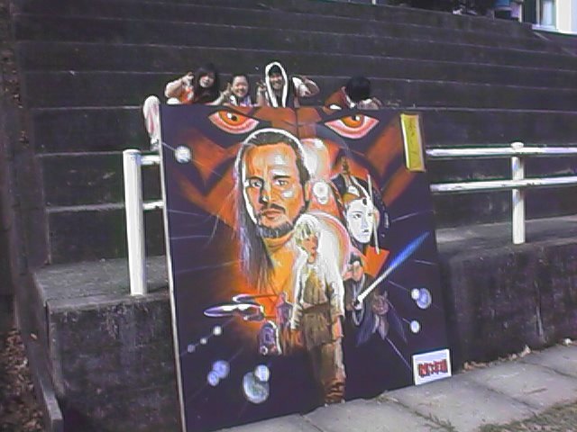 taku kids with star wars sign.jpg, 58109 bytes, 10/9/1999